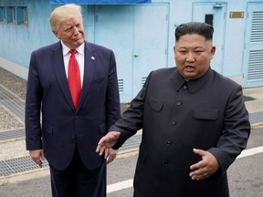 U.S. President Donald Trump meets with North Korean leader Kim Jong Un at the demilitarized zone separating the two Koreas, in Panmunjom, South Korea, June 30, 2019.