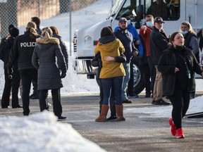Parents are reunited with their children after a shooting took place outside of the South Education Center school in Richfield, Minnesota, Tuesday, Feb. 1, 2022.