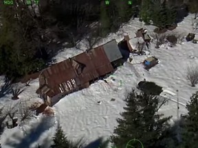 Screenshot of snowed-in cabin in which two people and dog were inside, trapped for two months.