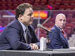 Kent Hughes listens to executive vice-president of hockey operations Jeff Gorton during a news conference introducing Hughes as the Montreal Canadiens' new general manager at the Bell Centre in Montreal on Jan. 19, 2022.