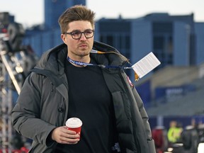 General manager Kyle Dubas of the Toronto Maple Leafs heads to a breazy practice prior a game against the Buffalo Sabres during the 2022 Tim Hortons NHL Heritage Classic at Tim Hortons Field on March 12, 2022 in Hamilton.