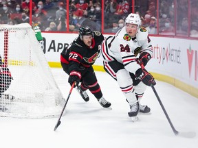 Sam Lafferty #24 of the Chicago Blackhawks skates against Thomas Chabot #72 of the Ottawa Senators during the first period at the Canadian Tire Centre on March 12, 2022.