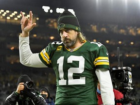 Aaron Rodgers #12 of the Green Bay Packers reacts as he walks off the field following the 45-30 victory over the Chicago Bears in the NFL game at Lambeau Field on December 12, 2021 in Green Bay, Wisconsin.