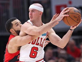 Alex Caruso of the Chicago Bulls is pressured by Fred VanVleet on Tuesday night.