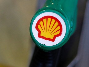 The Shell logo is seen on a pump at a Shell petrol station in London.