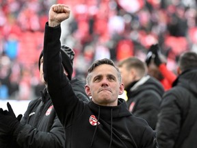 Canada head coach John Herdman reacts to fans after a win over Jamaica at BMO Field clinched qualification to the 2022 FIFA World Cup on March 27, 2022.