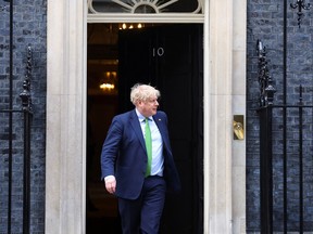 British Prime Minister Boris Johnson waits for Finnish President Sauli Niinisto outside Downing Street in London, Britain March 15, 2022.