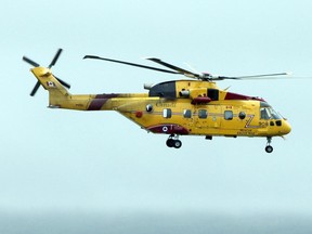 A Canadian Forces search and rescue CH-149 Cormorant helicopter flies over the St John's Airport as it takes off in St John's in this file photo taken on Aug. 5, 2010.