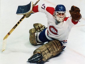 Canadiens goalie Steve Penney reaches out for the glove save in his 4-2 playoff win over the New York Islanders in Montreal on April 26, 1984.