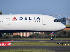 A Delta airlines aircraft landing from Los Angeles at Kingsford Smith International airport on October 31, 2021 in Sydney, Australia. (Photo by James D. Morgan/Getty Images)