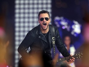 Eric Church performs during halftime of the game between the Washington Redskins and Dallas Cowboys at AT&T Stadium on November 24, 2016 in Arlington, Texas. (Photo by Tom Pennington/Getty Images)