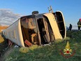 Firefighters work at the scene of an accident where a bus crashed while carrying Ukrainian citizens, between Forli and Cesena, Italy, March 13, 2022.