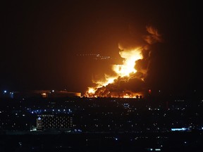 An Aramco oil depot close to the circuit is seen in flames following an incident during practice ahead of the F1 Grand Prix of Saudi Arabia at the Jeddah Corniche Circuit on March 25, 2022 in Jeddah, Saudi Arabia.