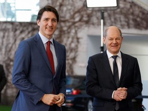 German Chancellor Olaf Scholz (right) greets Canadian Prime Minister Justin Trudeau as he arrives at the Chancellery in Berlin for talks on Wednesday, March 9, 2022.