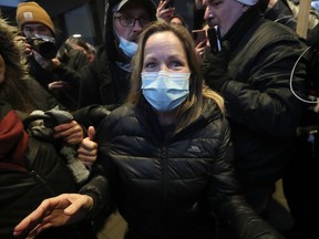 Convoy protest organizer Tamara Lich (wearing a mask) released on bail at the Ottawa court house in Ottawa Monday. Postmedia.