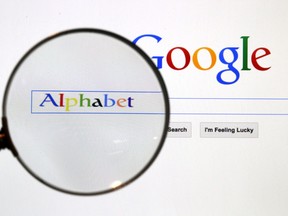 A Google search page is seen through a magnifying glass in this photo illustration taken in Berlin, August 11, 2015.