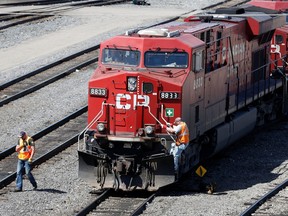 A Canadian Pacific Railway crew works on their train at the CP Rail yards in Calgary, Alberta, April 29, 2014.