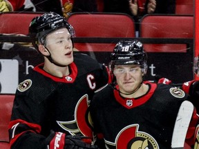 Ottawa Senators forward Tim Stuetzle (right) is congratulated by teammate Brady Tkachuk after scoring a goal on Feb. 15, 2022.
