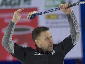 Team Wild Card 1 skip Brad Gushue celebrates after defeating Saskatchewan 9-7 in the Page Playoff 3vs4 game at the Tim Hortons Brier in Lethbridge on March 12, 2022.