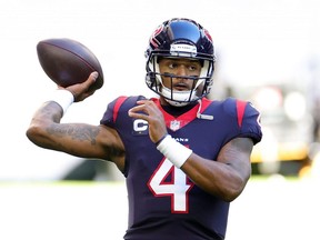 HOUSTON, TEXAS - JANUARY 03: Deshaun Watson #4 of the Houston Texans participates in warmups prior to a game against the Tennessee Titans at NRG Stadium on January 03, 2021 in Houston, Texas. (Photo by Carmen Mandato/Getty Images)
