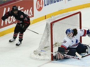 The puck is in the net after Canada's Marie-Philip Poulin scored on U.S. goalie Nicole Hensley in overtime of Rivalry Rematch game on March 12, 2022, in Pittsburgh.