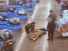 Screenshot of man lying in Walmart after being shot by a sheriffs deputy.