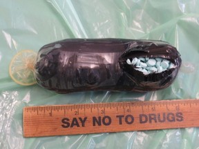Fentanyl packed in condom next to ruler with "Say No to Drugs" on it.
