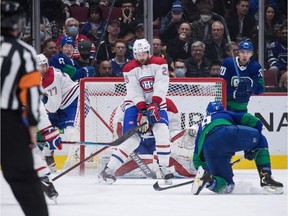 Montreal Canadiens' Jeff Petry (26) blocks Vancouver Canucks' J.T. Miller's shot on goal during the first period of an NHL hockey game in Vancouver, on Wednesday, March 9, 2022.