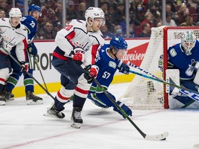 Washington Capitals forward Lars Eller (20) skates out of check against the Vancouver Canucks in the second period at Rogers Arena.