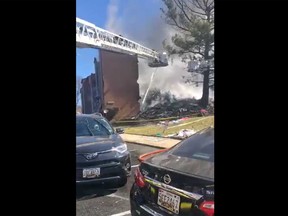 The scene of a Maryland residential high-rise fire on Friday is pictured in a screengrab of a video posted by Pete Piringer, spokesperson for Montgomery County Fire and Rescue Service on Twitter.