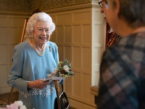 Queen Elizabeth talks to members of the West Norfolk Befriending Society earlier this year.