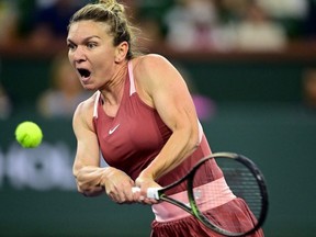 Mar 18, 2022; Indian Wells, CA, USA; Simona Halep (ROM) hits a shot during her semifinal match against Iga Swiatek (ITA) during the BNP Paribas Open at the Indian Wells Tennis Garden.