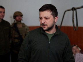 Ukraine's President Volodymyr Zelenskyy visits people who were injured while fleeing from Kyiv's outskirts as Russia's attack on Ukraine continues, at a hospital in Kyiv, Ukraine March 17, 2022.