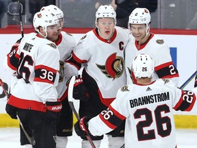 Senators captain Brady Tkachuk, middle, celebrates his first-period goal against the Jets with, left to right, Colin White, Josh Norris, Artem Zub and Erik Brannstrom.