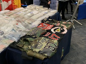 Various items including clothing, assault-style rifles, cocaine, methamphetamine, fentanyl and MDMA on display at a press conference at RCMP D Division Headquarters in Winnipeg on Tuesday, March 29, 2022, announcing the results of Project Divergent, a drug investigation lasting almost four years and involving police agencies across Canada as well as the United States, Colombia and Greece. It was the largest drug seizure in Manitoba RCMP history and involved the arrests of 22 people including a high-ranking full patch Hells Angels member.