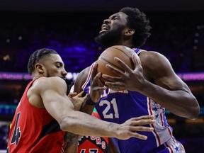 Joel Embiid #21 of the Philadelphia 76ers drives against Khem Birch #24 of the Toronto Raptors in the first quarter during Game 5of the Eastern Conference First Round at Wells Fargo Center on Monday night.