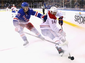Canadiens' Nick Suzuki carries the puck ahead of Frank Vatrano of the New York Rangers at Madison Square Garden on April 27, 2022, in New York City.