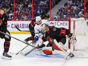 Mitch Marner #16 of the Toronto Maple Leafs scores on Anton Forsberg of the Ottawa Senators.