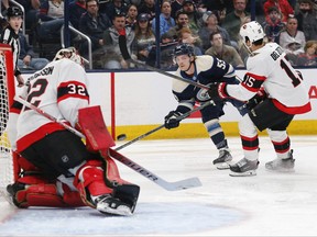 Ottawa Senators goalie Filip Gustavsson (32) makes a save on the shot of Columbus Blue Jackets right wing Carson Meyer (55) during the second period at Nationwide Arena on Friday night.