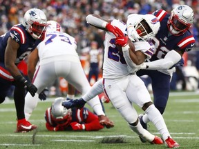 Devin Singletary of the Bills runs the ball during the fourth quarter against the Patriots at Gillette Stadium in Foxborough, Mass., Dec. 26, 2021.