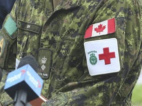 Members of the Canadian military lined up in droves to get their first dose of the COVID-19 vaccine in Toronto, April 30, 2021.