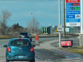 Motorists are pictured a gas station in Belleville, Ont., on March 5, 2022.
