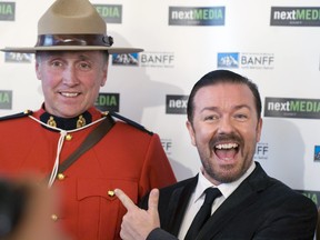 Ricky Gervais laughs with Banff RCMP Const. Mark Genge, dressed in red serge, at the Banff World Television Festival at the Banff Springs Hotel on June 15, 2010.