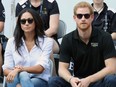 Prince Harry (R) and Meghan Markle attend a wheelchair tennis match during the Invictus Games 2017 at Nathan Phillips Square on September 25, 2017 in Toronto.