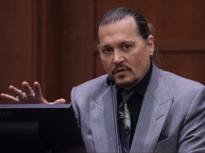 Johnny Depp testifies during his defamation trial against his ex-wife Amber Heard at the Fairfax County Circuit Courthouse in Fairfax, Va., April 20, 2022.