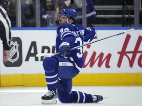 Toronto Maple Leafs centre Auston Matthews (34) celebrates after scoring his 60th goal of the season, in the third period against the Detroit Red Wings on Tuesday night at Scotiabank Arena.