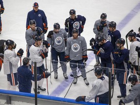 Edmonton Oilers head coach Jay Woodcroft talks to players during practice on March 18, 2022, in Edmonton.