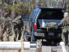 Members of the Royal Canadian Mounted Police pack their bags after the search for Gabriel Wortman in Great Village, Nova Scotia, April 19, 2020.