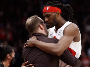 Raptors' Precious Achiuwa hugs head coach Nick Nurse in the second half of Game Four of the Eastern Conference First Round series against the 76ers at Scotiabank Arena in Toronto, Saturday, April 23, 2022.