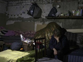 A woman cries inside a bunker in Popasna, Donbass region, on April 14, 2022 amid Russian invasion of Ukraine.